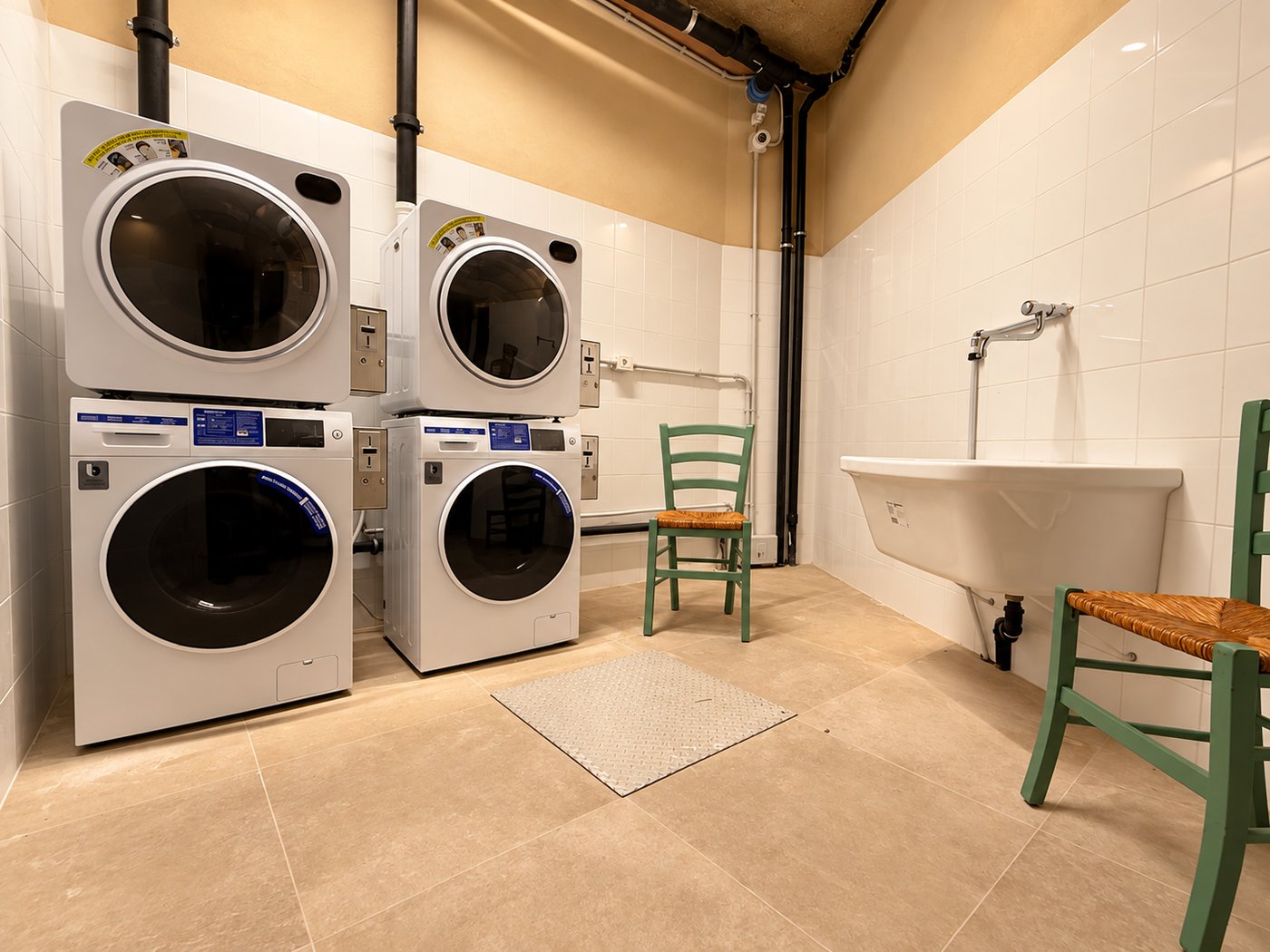 Laundry room with professional washers student residence Verona